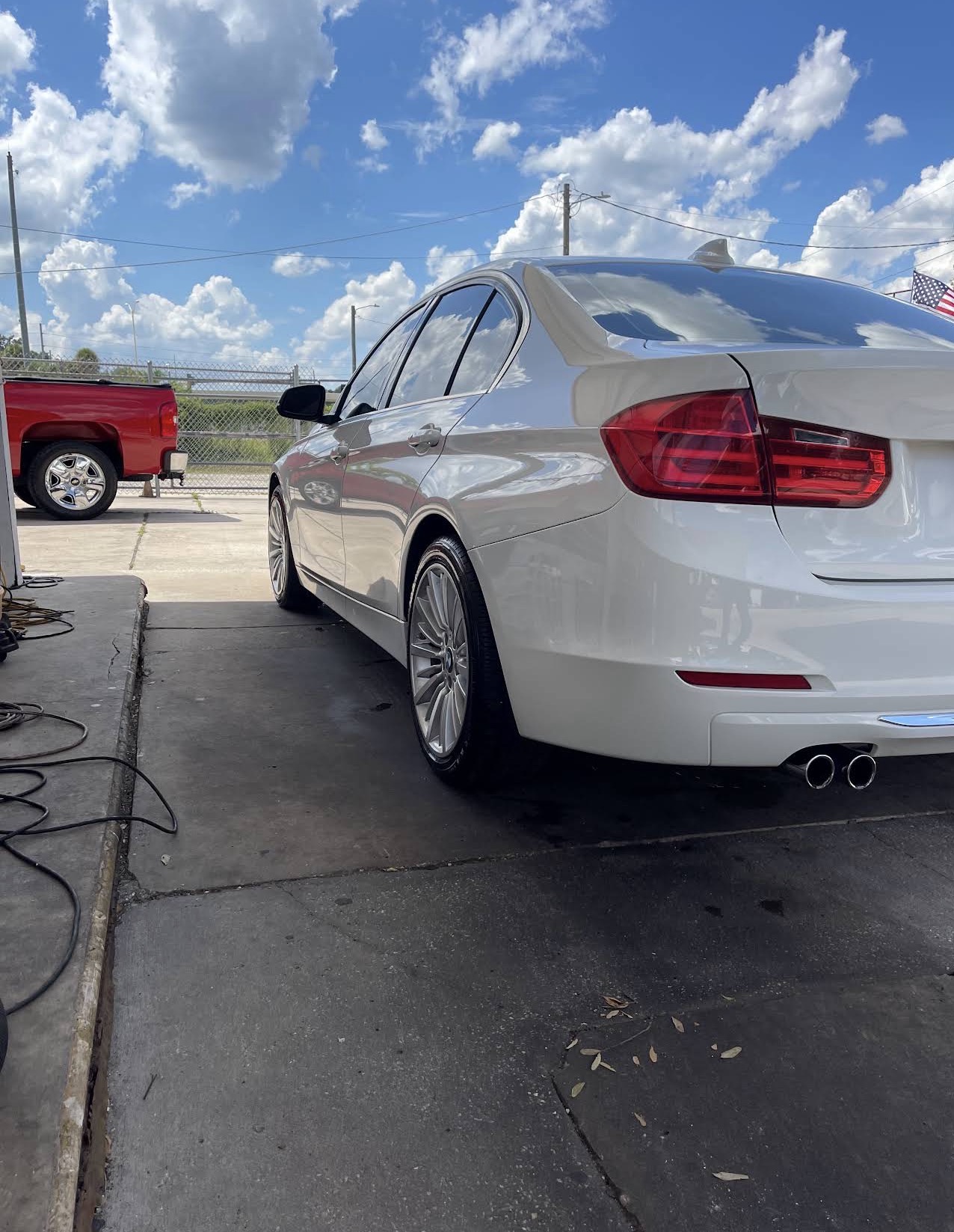 Polished white BMW 3 Series after an exterior detail